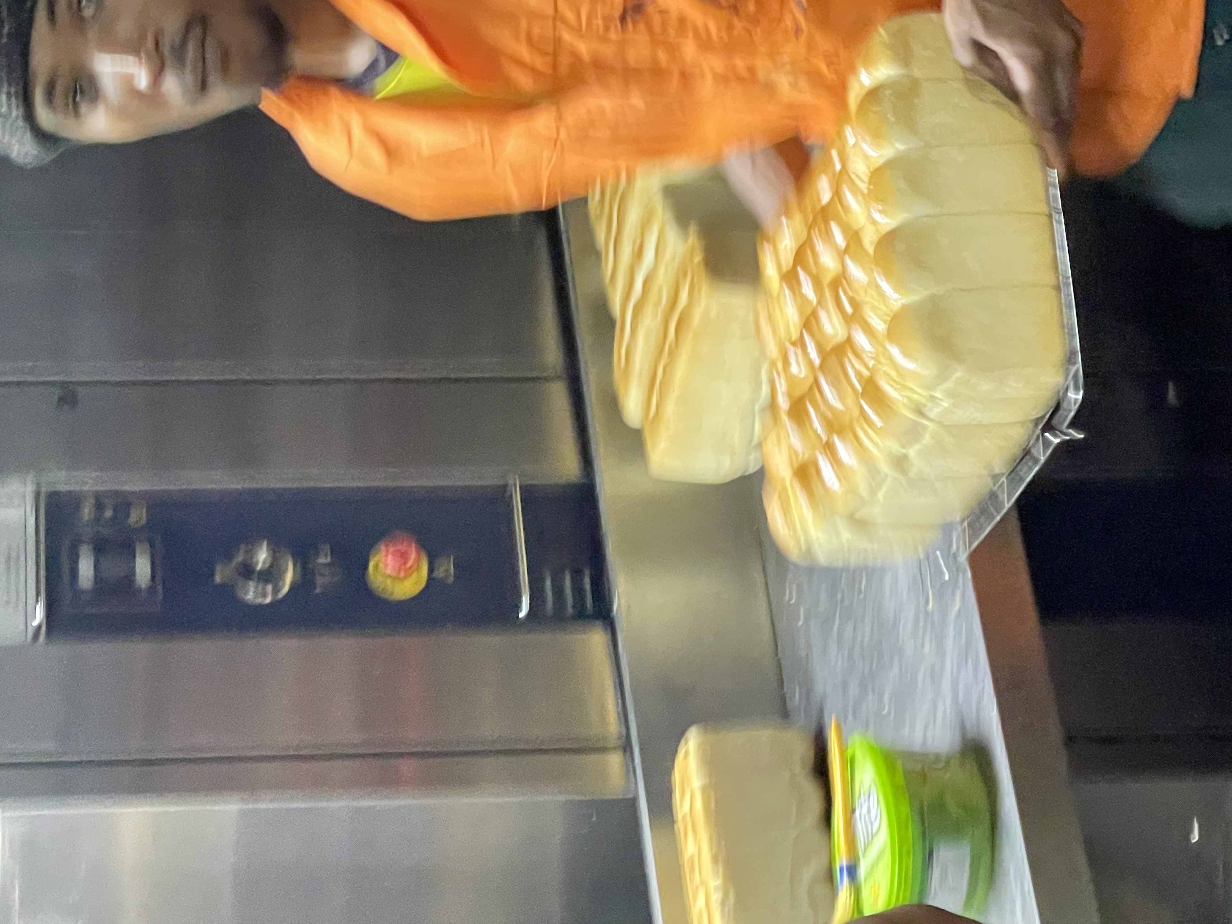 Baker carrying fresh loaves